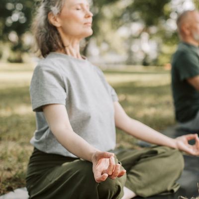 Close-up of a person practicing deep breathing exercises in a calm setting.